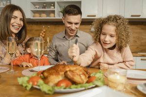 play therapy. thanksgiving. family at table.