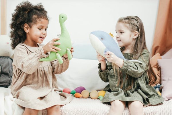 play therapy in frisco, tx. girls playing with toys.